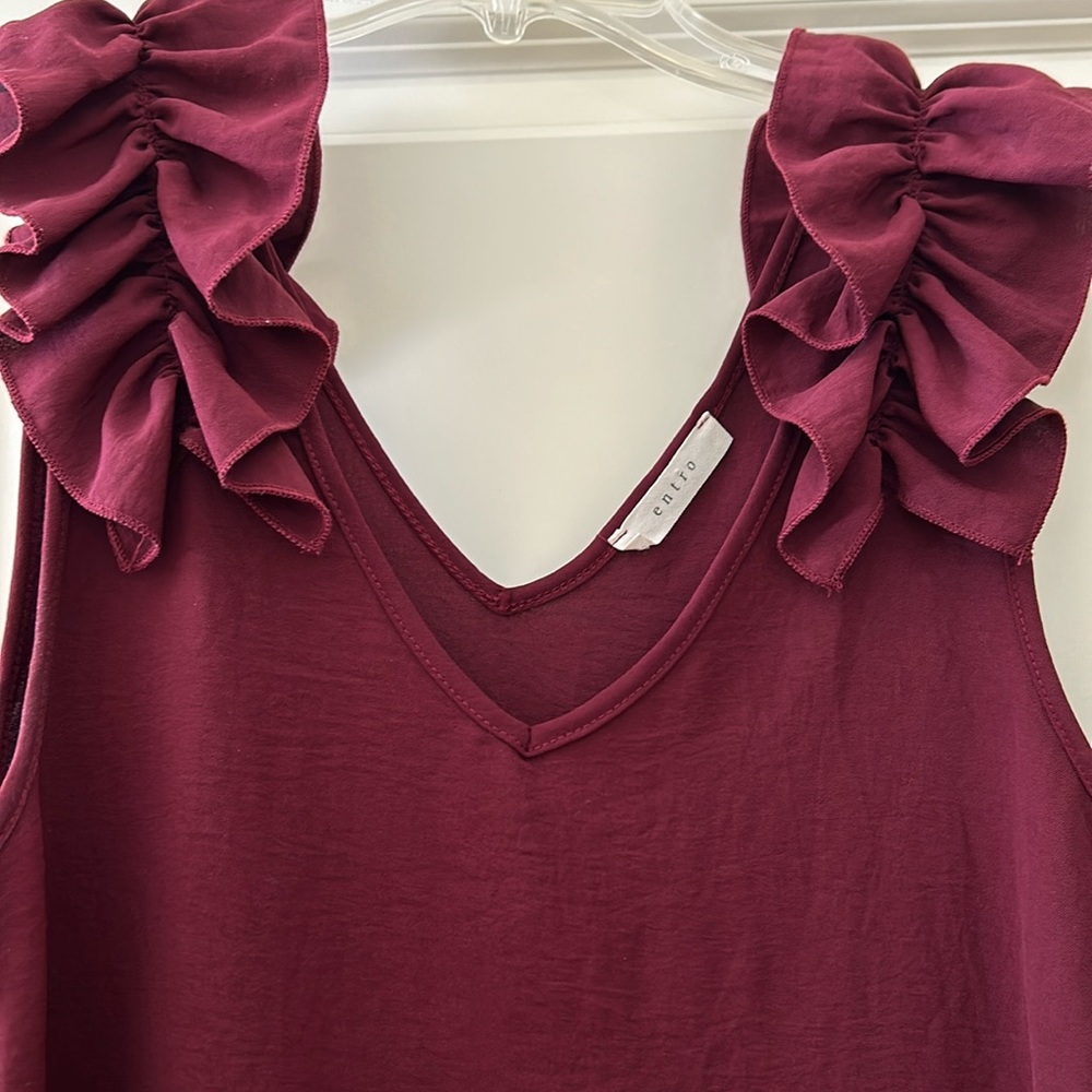 Entro shirt. Think it’s a size large. Maroon.